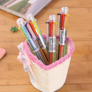 Minimalist 6-color transparent ballpoint pens set in a decorative desktop holder