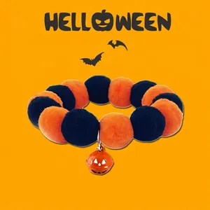 Halloween pet collar with orange and black plush balls and pumpkin bell pendant