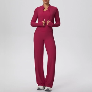 Detail of dark red three-piece yoga set featuring zipper jacket, vest and wide-leg pants