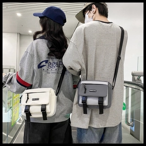 Couples wearing retro crossbody bags with flap closure and dual black buckles shown from behind