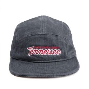 Detail of red and white 3D embroidery on charcoal grey five-panel cotton camper cap