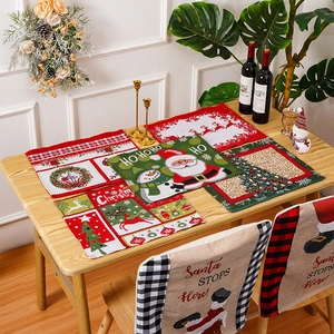 Detail view of woven Christmas placemats and linen chair covers with festive Santa designs