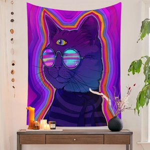 Artistic purple cat tapestry hanging above a wooden console table with plants