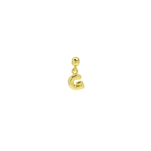Close-up of a 18k gold-plated 3D bubble letter G pendant with a high-polished finish