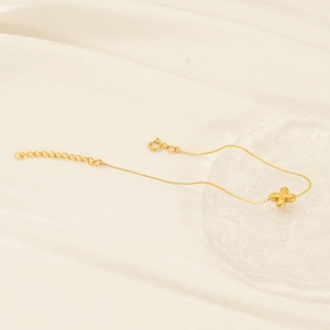Minimalist 18K gold plated stainless steel bracelet with X-shaped pendant and adjustable chain