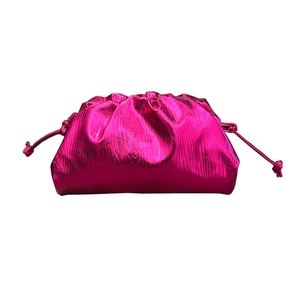 Metallic magenta ruched cloud bag with drawstring closure and glossy finish on white base
