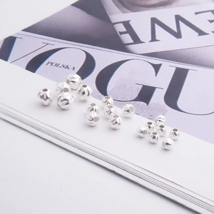 Detailed macro view of S925 sterling silver textured spacer beads in various sizes