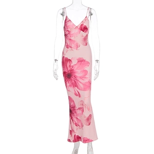 Detail of pink floral print dress featuring thin straps and elegant V-neckline cut
