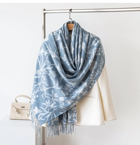 Blue and white floral cashmere shawl with fringe styled over a white blazer suit