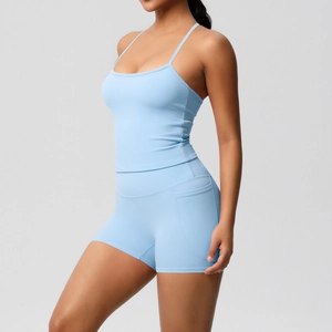 Light blue yoga set detail showing functional side pocket on high waist sports shorts