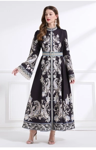 Detail of vintage high collar lace cuffs and ethnic print on a black long sleeve maxi dress