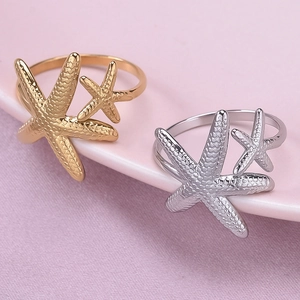 Minimalist 18K gold and silver starfish ring set with textured irregular overlap design