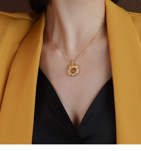 Professional look of an 18k gold plated textured irregular pendant necklace on a model
