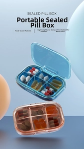 Macro detail of compact 6-compartment pill box with translucent moisture-proof seal