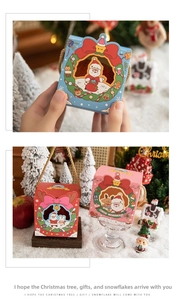Close-up of Christmas gift boxes with hemp rope handles and festive Santa illustrations