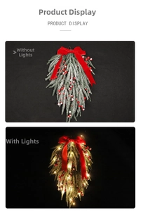 Detail of Christmas teardrop swag with red berries, pine needles and velvet bow