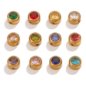 Macro detail of colorful crystal inlaid 6mm round gold-plated stainless steel spacer beads