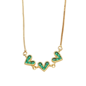 Elegant gold necklace with three connected green crystal heart pendants on box chain