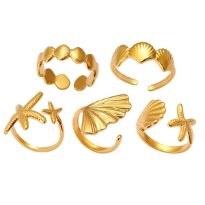 Five-piece gold adjustable ring set featuring ocean starfish and seashell elements