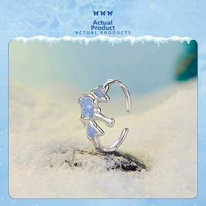 Detailed macro view of S925 sterling silver snowflake ring with light blue enamel finish