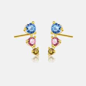 Detailed view of gold earrings with vertical blue, pink, and yellow-green crystals