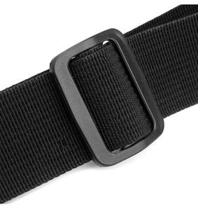 Close-up of adjustable black fabric strap and plastic buckle on tactical chest rig