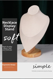 Detailed view of beige velvet necklace stand with round beech wood base for jewelry display