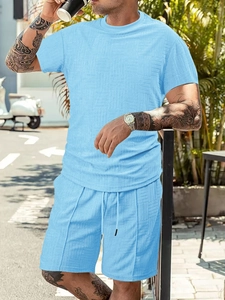 Close-up of light blue waffle knit texture on a men's summer short sleeve leisure set