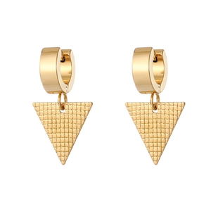 Detail of golden geometric earrings featuring round hoops and textured triangle charms