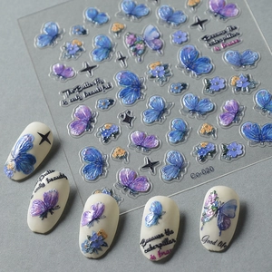 3D butterfly and floral nail art stickers with butterfly patterns on white matte nails
