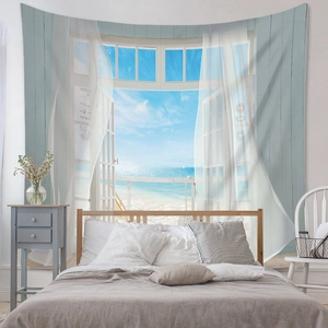 Detail view of seaside window scenery tapestry hanging on a minimalist bedroom wall