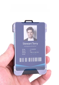 Handheld view of aluminum RFID card holder with silver frame and deep blue panel