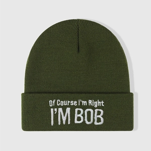 Dark green knitted beanie hat with white embroidery text 'Of Course I'm Right I'M BOB'