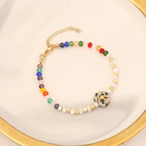 Colorful handmade beaded heart stone bracelet with gold accents and extension chain