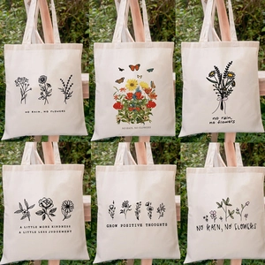 Set of six beige canvas tote bags with floral prints and inspirational English quotes