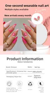 Close-up of pink stiletto press-on nails with 3D floral relief and gold accents