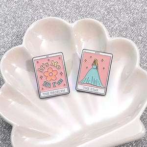Pink tarot enamel pin set with The Star and The Problem designs on a shell plate