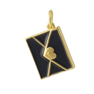 Macro shot of 18K gold plated envelope pendant with black enamel and a golden heart