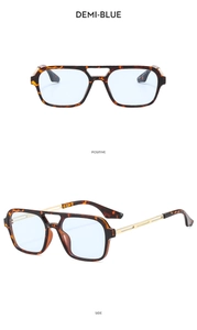 Detail view of demi-blue double bridge pilot frames with golden metal temples