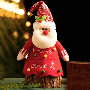 Plush Santa doll with Merry Christmas embroidery and a wooden stump base for decor