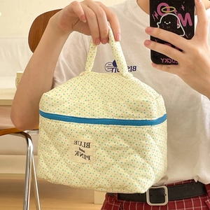Quilted cotton makeup bag with colorful polka dots, blue zipper and top handle