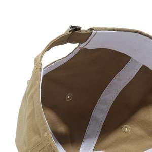 Detailed interior of khaki baseball cap showing sweatband and reinforced inner seams