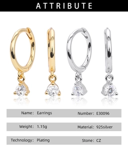 Detailed view of 925 silver hoop earrings with dangling round CZ stones in gold and silver