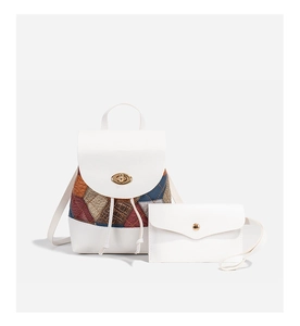 Detail view of white backpack and coin purse set with colorful crocodile pattern texture
