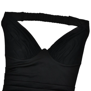 Close-up of black halter neck dress featuring ruched fabric and sweetheart neckline