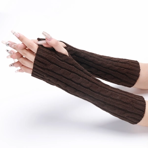 Close-up of coffee brown knit arm warmers with detailed cable pattern and fingerless design