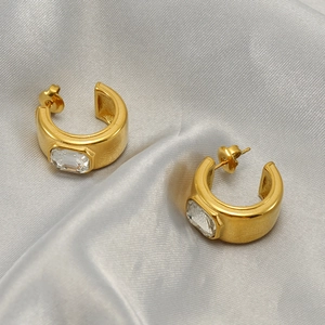 18K gold plated stainless steel C-shape earrings with rectangular zircon on silk background