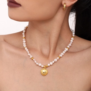 Handmade baroque freshwater pearl necklace with 18k gold plated pendant on model