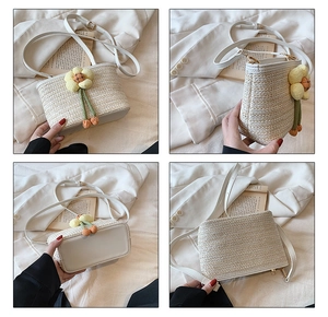 Detailed views of a beige straw bucket bag with floral detail and white leather trim