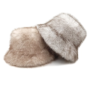 Plush faux fur winter bucket hats in light brown and cream for warm outdoor fashion